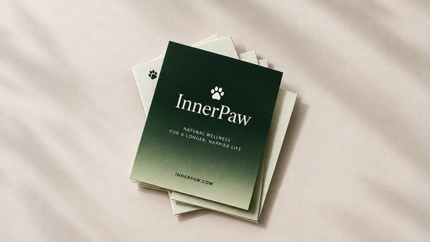 InnerPaw brochure cards with paw icon and Natural Wellness for a longer, happier life